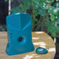 Bark Control Pro™ outside on a table with its included remote